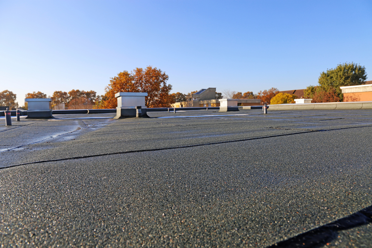 Commercial Roofing Services Building With Newly Renovated Flat Roof Sealing